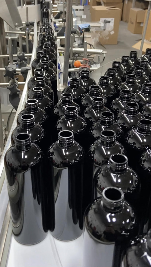 bottles on assembly line